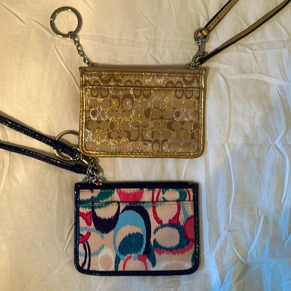 Two coach wristlets.   Gold is EUC. Blue NWT.